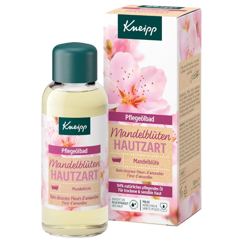 Kneipp Mandelblüten Hautzart hand care oil in a clear bottle with a dark green cap, shown next to its matching pink and beige floral packaging box on a white background.