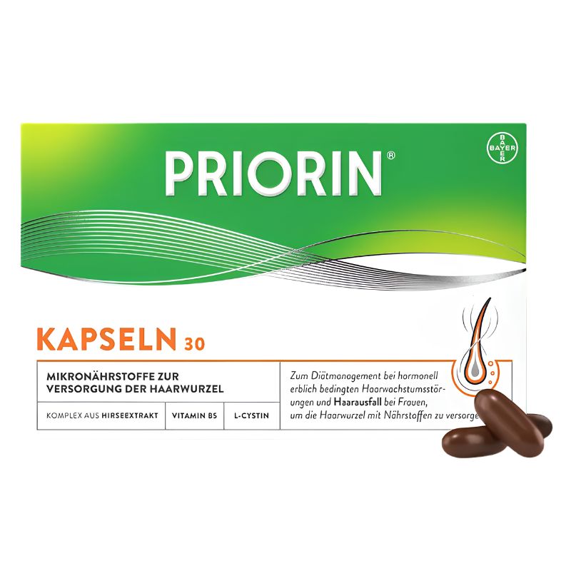 A box of Piorin Kapseln 30 hair supplement capsules, featuring a green and white design with orange text and two brown capsules shown in the lower right corner.
