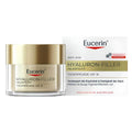 Eucerin Hyaluron-Filler + Elasticity anti-age skincare set, featuring a clear jar with a metallic gold lid and a white and gold product box on a plain white background.