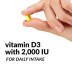 A hand holding a small golden-yellow vitamin D3 softgel capsule against a white background, with text below reading 'vitamin D3 with 2,000 IU FOR DAILY INTAKE'.