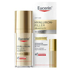 Eucerin Hyaluron-Filler + Elasticity 3D Serum shown as a clear bottle with a gold cap next to its white and gold retail box on a white background.