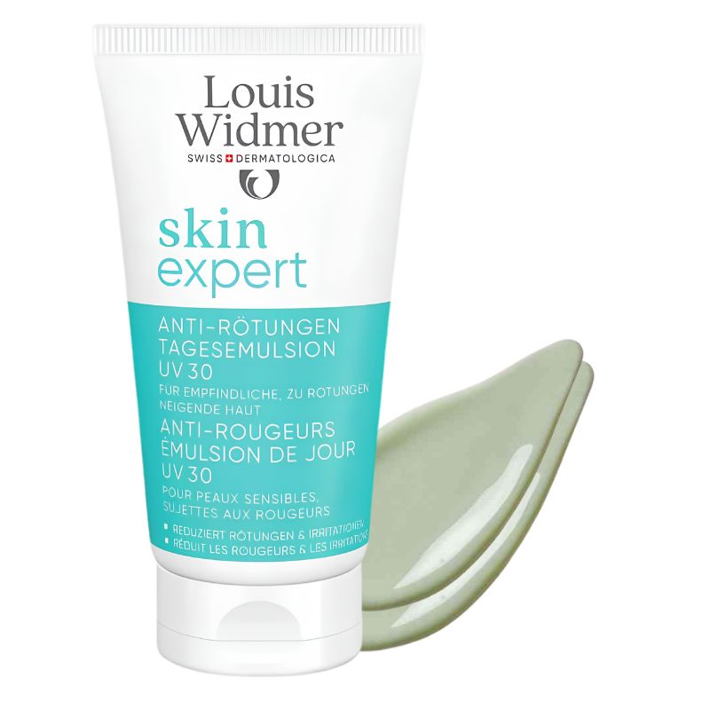 A white squeeze tube of Louis Widmer Skin Expert UV30 anti-redness emulsion, shown with a pale green liquid smear behind it on a white background.