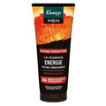 A squeeze tube of Kneipp Men hair and face care product, featuring a dark brown and black label with a vibrant orange citrus slice graphic at the top, on a plain white background.