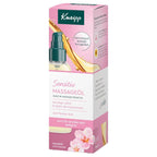 Kneipp Sensitiv Massageöel in a pink and white box with a pump bottle graphic, featuring a pink cherry blossom flower illustration and German text.