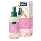 Kneipp Sensitiv Pflegeol sensitive skin care oil in a clear spray bottle with a dark green pump, shown next to its pink and white retail box on a white background.