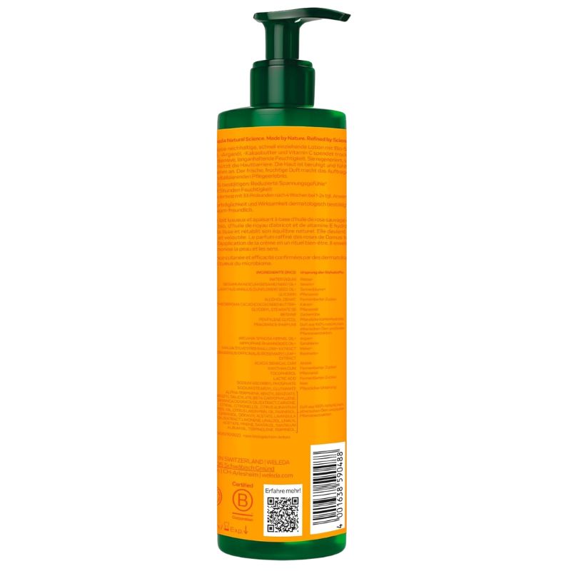 A tall pump bottle shown from the back, featuring a bright orange label with dense text, a dark green pump dispenser, and a barcode near the bottom, isolated on a white background.