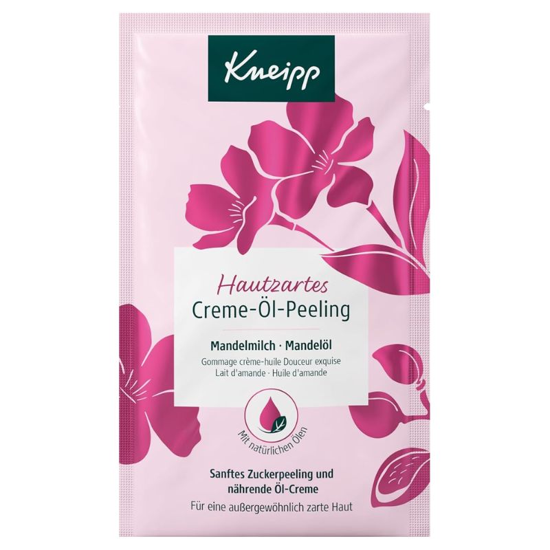 Kneipp Hautzartes Creme-Öl Peeling facial sheet mask in a pink foil packet with magenta floral graphics and a white text panel.