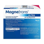 A box of Magnetrans Ultra dietary supplement containing 375 mg Magnesium, featuring a blue and white design with German text and a vegan badge.