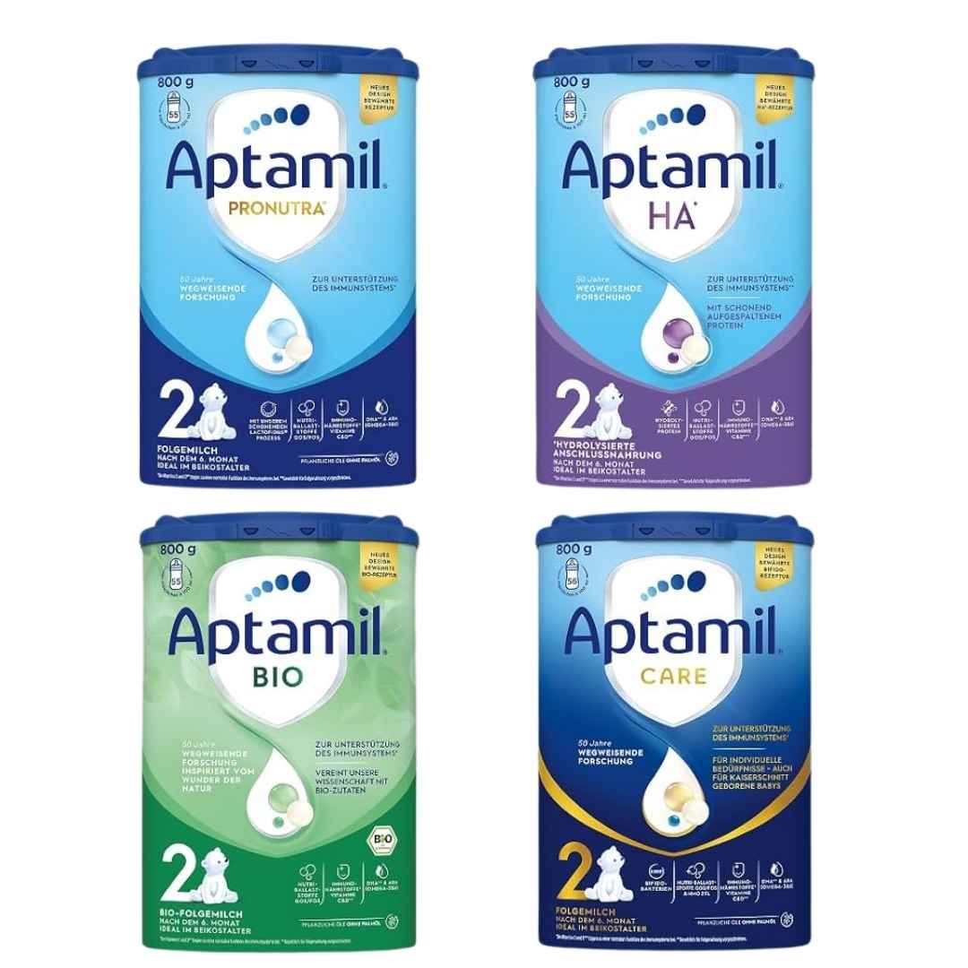 Four packages of Aptamil baby formula 2 collection on a white background