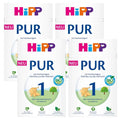 Four packages of HiPP PUR baby formula on a white background