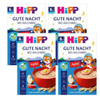 Three packages of HiPP Gute Nacht organic apple baby cereal on a white background