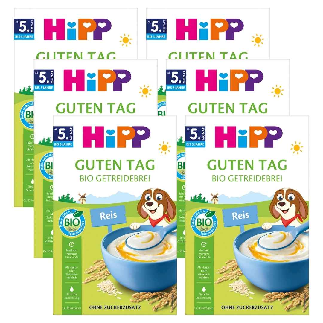 Multiple packages of HiPP cereal with colorful branding and a cartoon dog character.