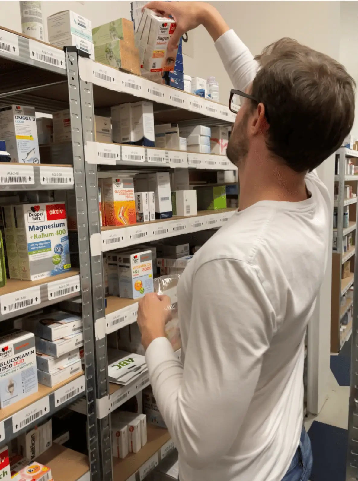 The founder of VicNic stocking Doppelherz and other health supplements at our physical warehouse in Hamburg, Germany.