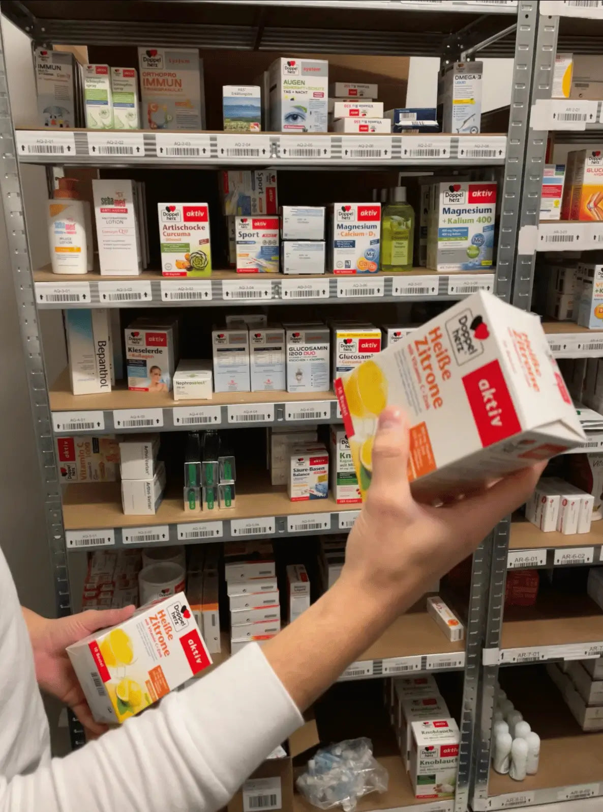 A VicNic team member manually auditing product batch numbers and expiration dates prior to international shipping.