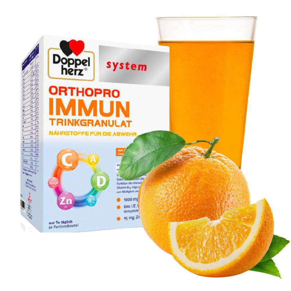 The box of Doppelherz OrthoPro Immune next to an orange that has been cut open and a glass.