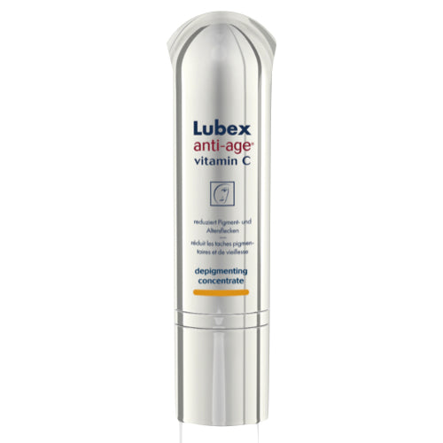 A bottle of Lubex Anti-Aging Vitamin C serum with a white and silver design, depicting the product as a depigmenting concentrate for skincare.
